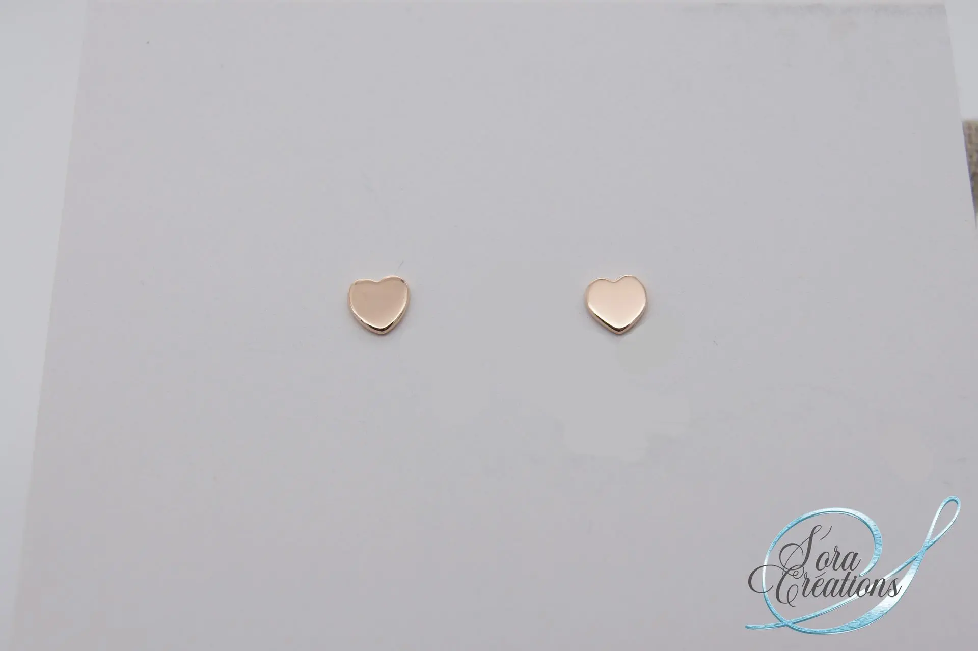 Boucles d&#39;oreilles or rouge motif coeur